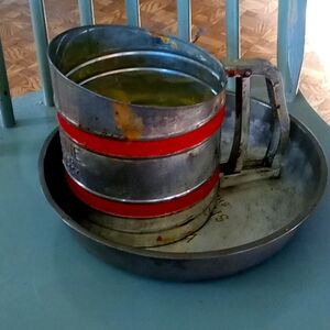 Vintage flour sifter with a pan